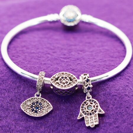 Sterling Silver Bangle Charm Bracelet with Humes Hand, Evil Eye Solid Bead & Hanging Evil Eye Charms. Bracelet is Accented with Uniquely Designed Round Clasp with Blue CZ