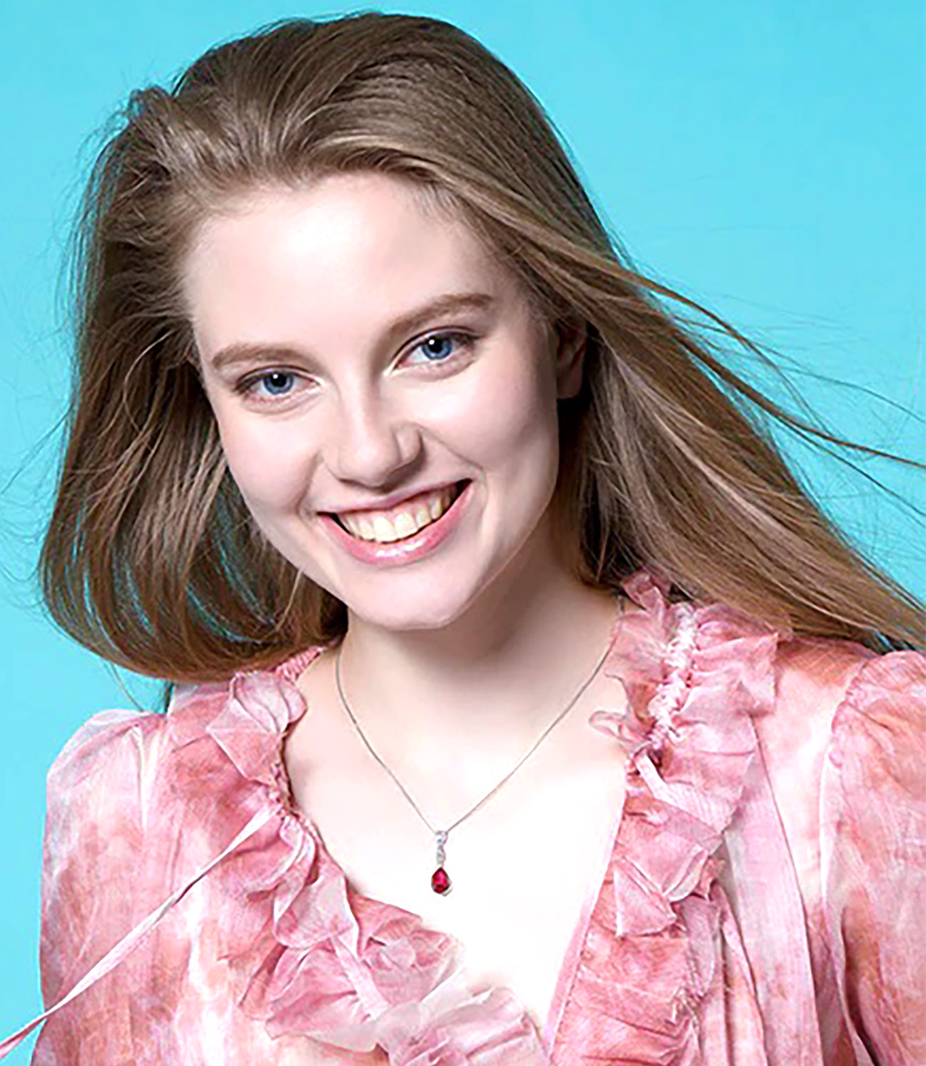 Sterling Silver Pear Shaped Ruby Lab Created Non-Treated Pendant Accented with Two Round Cubic Zirconia Stones 925ijewel.com