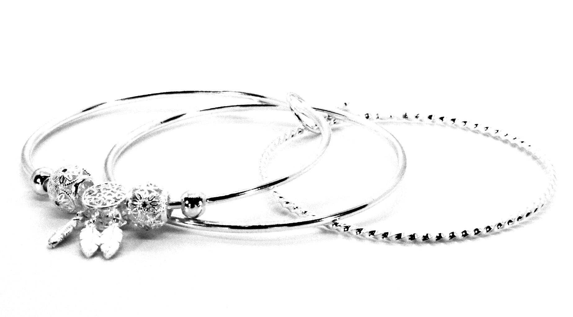Premium Sterling Silver – Crafted from high-quality 925 sterling silver for durability and shine. Slip-On Comfort – Easy-to-wear design ensures a secure and comfortable fit. Triple Bangle Design – Unique layered look adds depth and elegance. Diamond-Cut Beads – Five shimmering beads that sparkle beautifully in the light. Feather Charms – Four hanging feathers symbolizing freedom, grace, and individuality. Versatile Style – Perfect for both casual wear and special occasions. 925ijewel.com