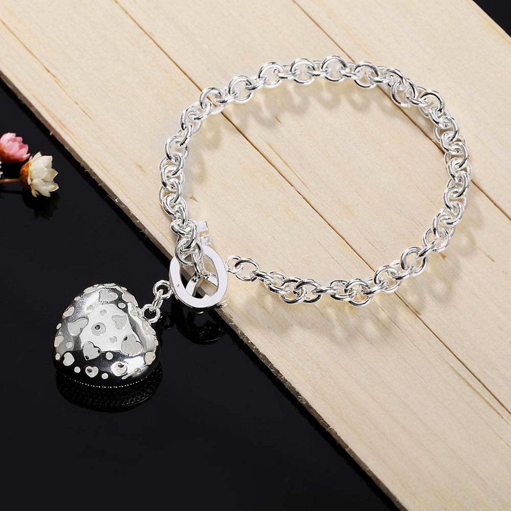 Key to My Heart Sterling Silver Puffed Heart Bracelet with Cut-Out Hearts and Florentine Finish. 925ijewel.com