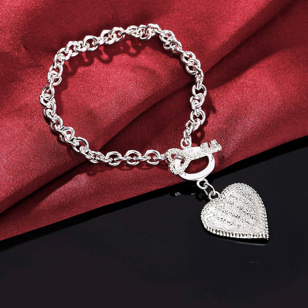 Key to My Heart Sterling Silver Puffed Heart Bracelet with Cut-Out Hearts and Florentine Finish. 925ijewel.com