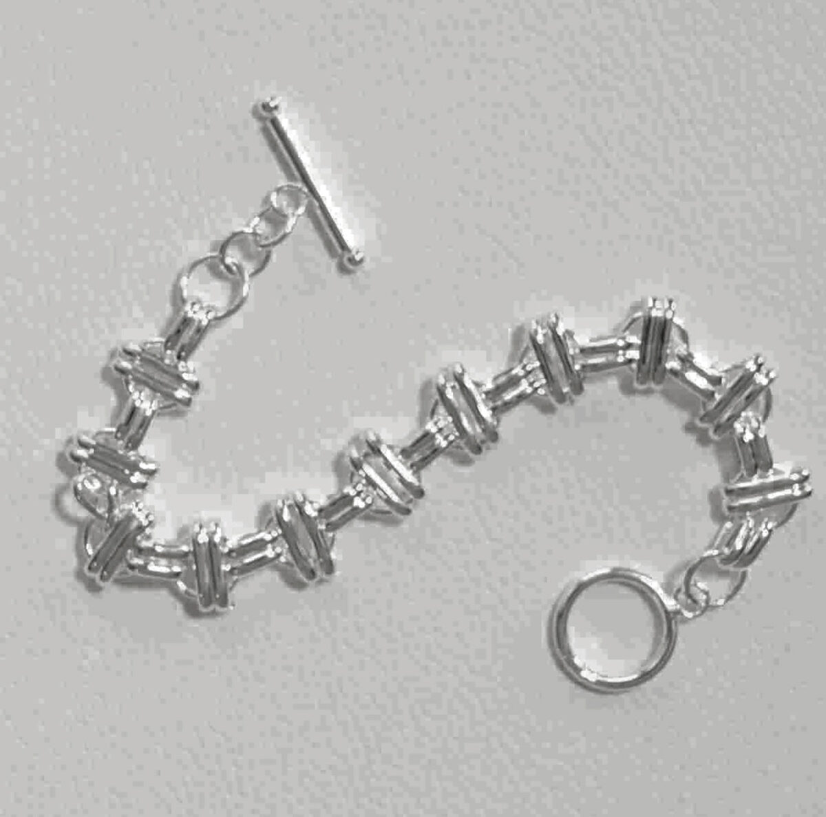 Sterling Silver Interlinked Grace Double Bar and Spaced Circles Bracelet with Toggle Clasp. 925ijewel.com